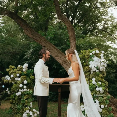 Faux hydrangea pillars styled for a ceremony